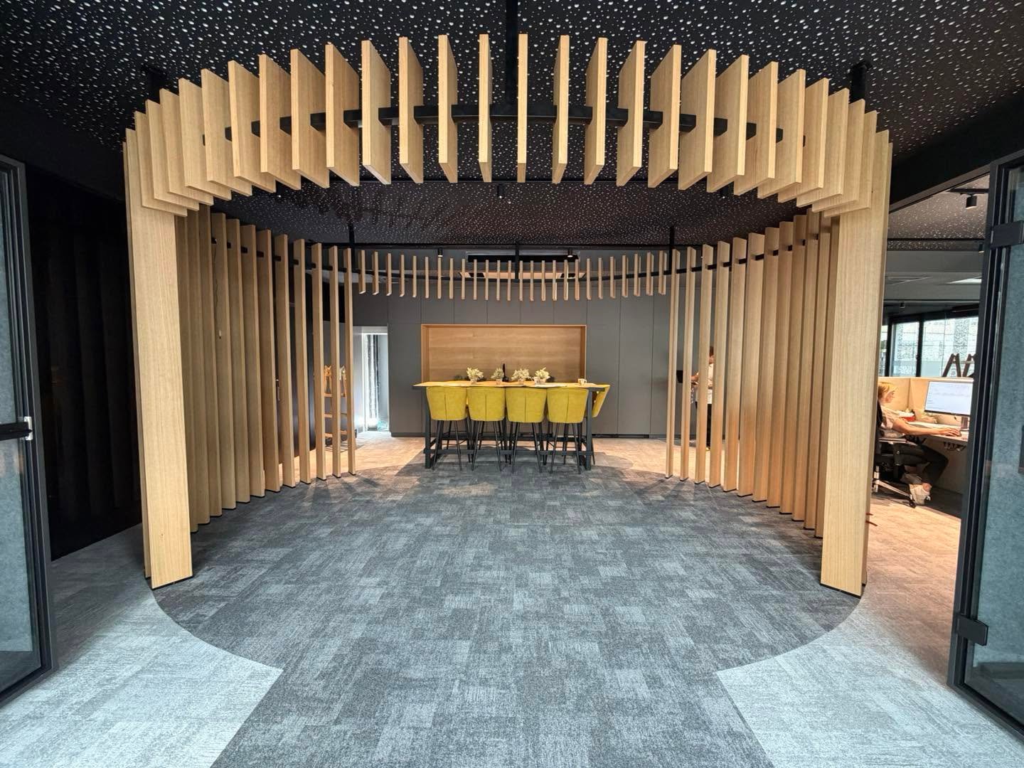 ISO Team Offices — oak slat feature structure over the meeting area